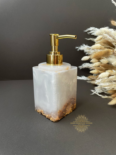 Pearl soap dispenser with a gold pump