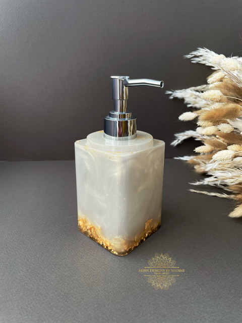Gold soap dispenser with a silver pump