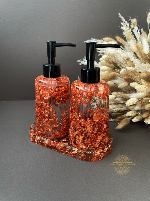 Two copper soap dispensers